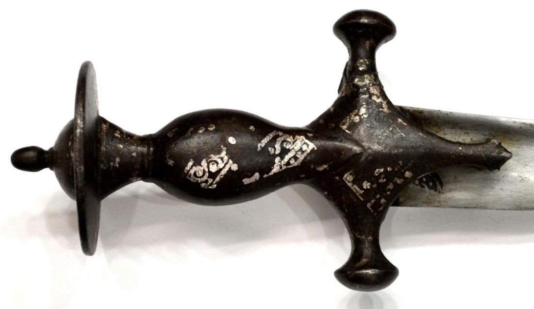 INDO-PERSIAN TALWAR SWORD & SCABBARD: Indo-Persian Talwar sword with scabbard, late 18th c., curved 28" blade, fuller at each side, slight remnants of silver inlay on 5.75" handle, worn leather over wood scabbard, overall: 33.25"l, 3.5"w.