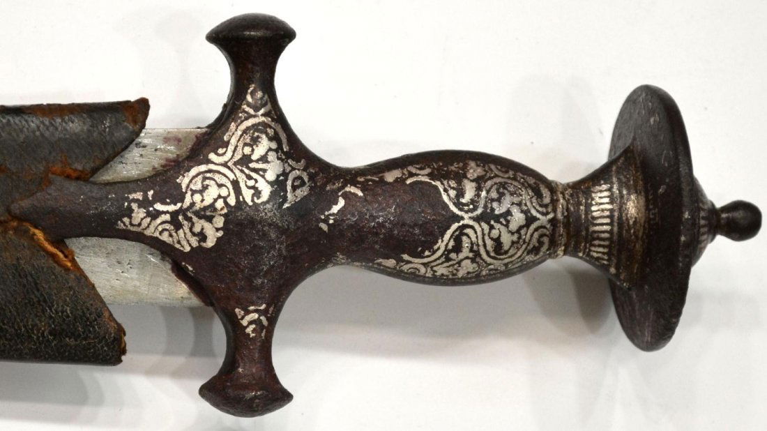 INDO-PERSIAN CURVED SWORD, SILVER INLAY, 19TH C.: Indo-Persian Talwar sword with scabbard, c. 19th c., curved 31" blade, remnants of silver inlay on 5.75" handle, worn leather scabbard, overall 38"l, 1.5lbs (15919)