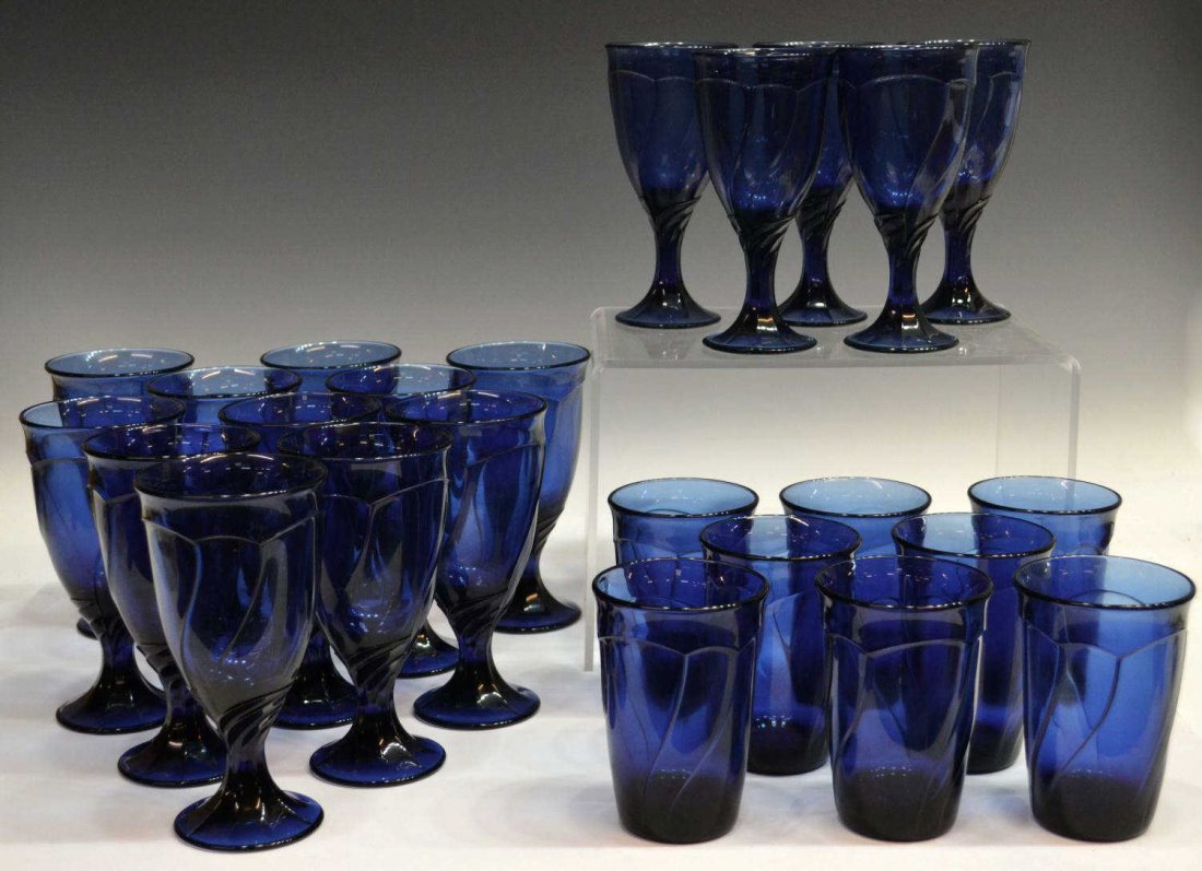 (24) NORITAKE 'SWEET SWIRL' MIDNIGHT BLUE STEMWARE: (lot of 24) large Collection of Noritake Crystal 'Sweet Swirl' midnight blue glass stemware, comprising: (11) ice tea glasses, 7.5"h, 3.75"diam; (8) highball glasses, 5"h, 3.5"diam; (5) water goblets,