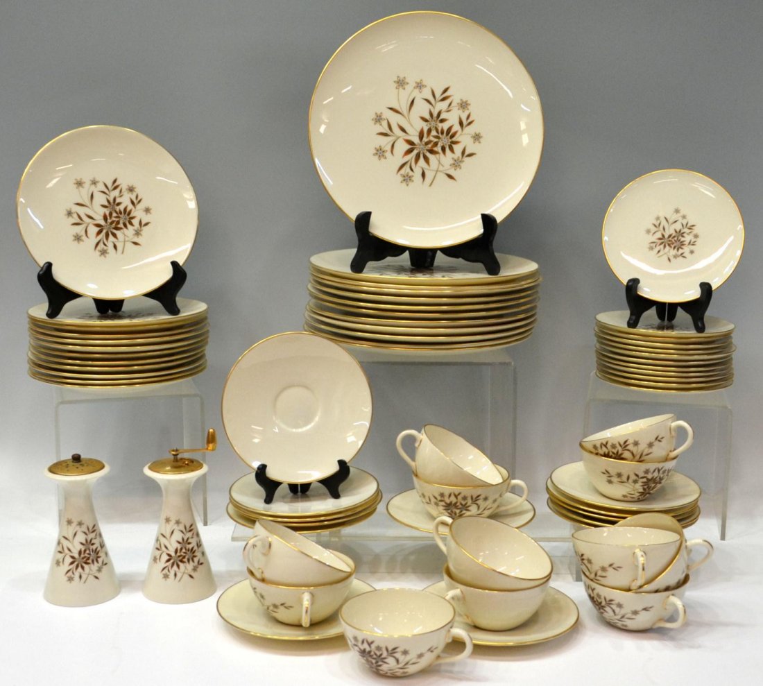 LENOX GILT RIM 'STARLIGHT' DINNER SERVICE: (set of 63) Lenox 'Starlight' pattern dinner service for (12), a gilded rim enclosing the cream ground centered by a floral spray with raised enamel embellishment, comprising: (12) dinner plates, 10.2