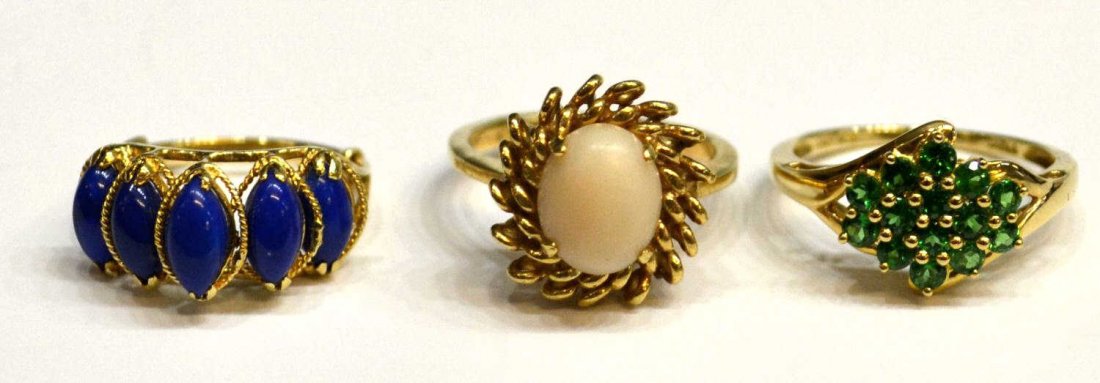 (3) LADIES 14KT GOLD STONE & GEMSET ESTATE RINGS: (lot of 3) Ladies 14kt gold stone and gemset rings: (1) set with multiple green stones, possibly tsavorite garnets, size 8; (1) set with five blue stones, metal ring sizer, size 4.25; (1) centering an