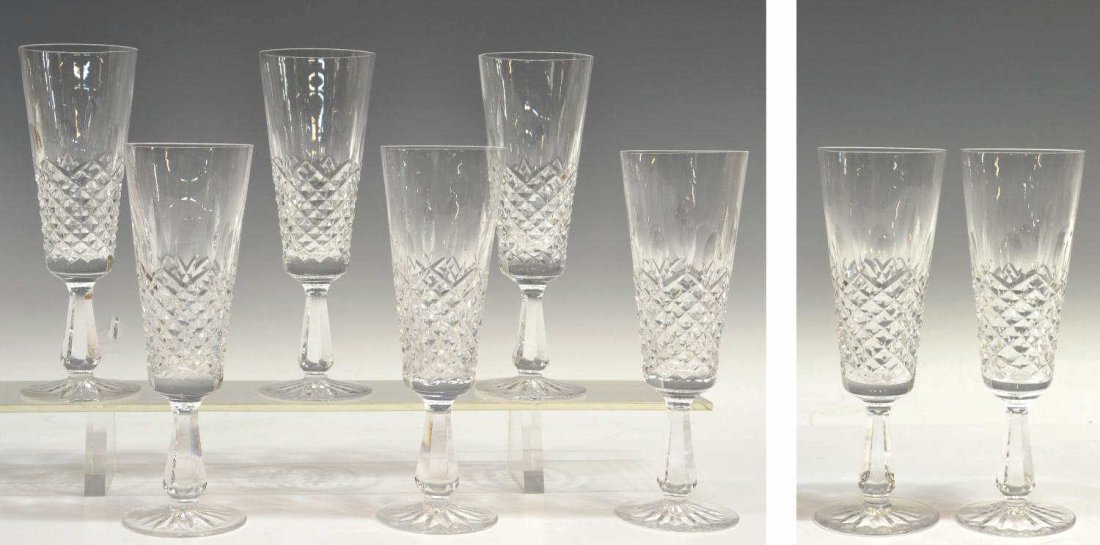 (8) WATERFORD CYRSTAL 'KENMARE' CHAMPAGNE FLUTES: (lot of 8) Waterford crystal 'Kenmare' pattern champagne flutes, one having small chip to rim, one with straw like imperfection to stem, 7.75"h, 2.75"diam, 6lbs total Start Price: $150.00