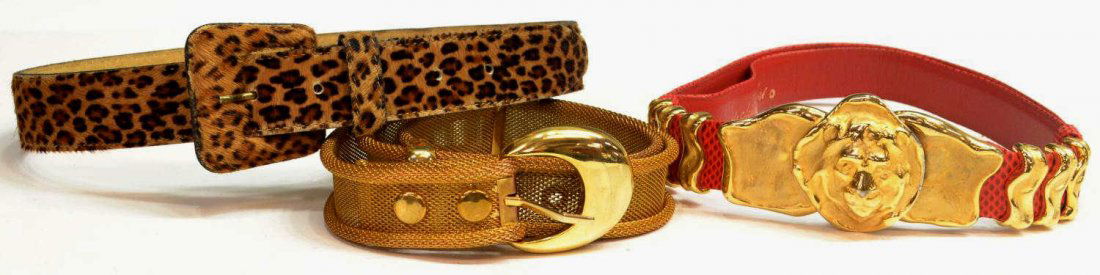 A JUDITH LEIBER RED REPTILE BELT & OTHER BELTS: (lot of 3) Vintage belts: (1) Judith Lieber in red reptile belt with figural gilt metal hardware, retaining dust bag, approx 35"l; (1) leather belt in a leopard print pattern, 'Accessories by Pearl',