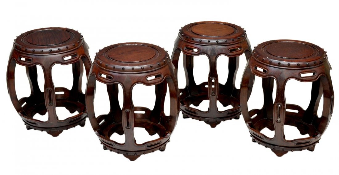 (4) CHINESE BARREL STOOLS: (lot of 4) Chinese hardwood barrel stools, Hong Kong, 20th c., circular seats rising on four bow form braces, conforming base and short bracket feet, 17.75"h, 16"d, 41lbs total Start Price: $100.00