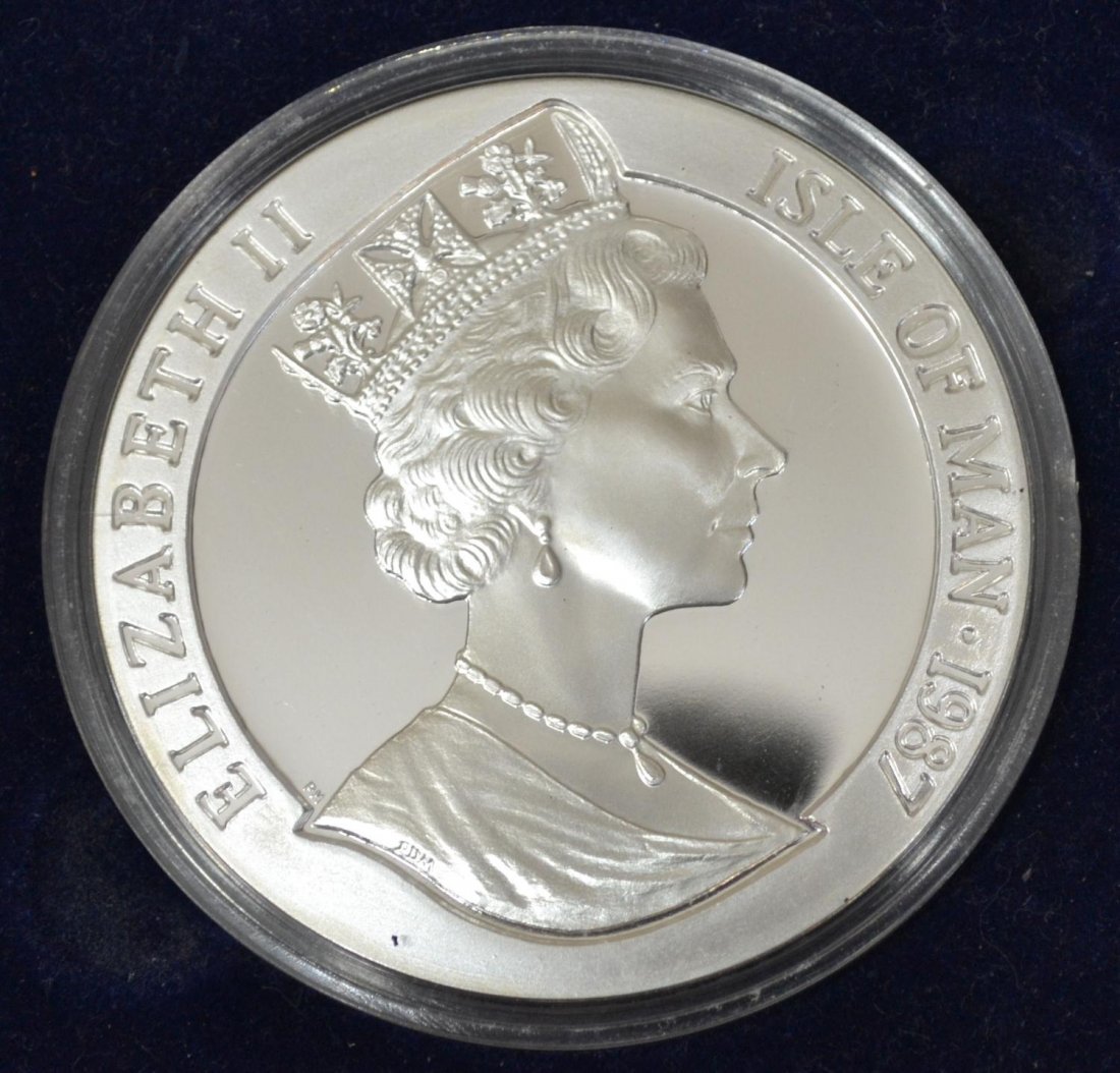 LARGE BRITISH 5 OUNCE SILVER COIN: Large silver coin, Elizabeth II, Isle of Man, 1987, The America's Cup Challenge, Freemantle, 5 crowns, "Fine Silver 5 ounces", housed in worn box from Popjoy Mint, Sutton Surrey, England, coin: 3.5"d,