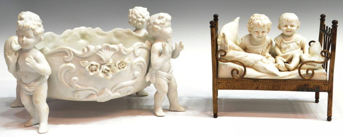(2) VICTORIAN BISQUE PUTTI FIGURES & CENTER BOWL: (lot of 2) Victorian bisque figural groups, comprising: (1) two joyful children surrounded by pillows, set in decorative metal bed frame, chip to underside, toes with loss on one foot, 6"h, 6.75"w, 4"