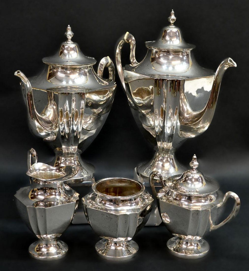 VINTAGE MEXICAN STERLING SILVER TEA & COFFEE SET: (set of 5) Vintage sterling silver tea and coffee service, Mexico, each of classical form rising on a pedestal foot, bone insulators, comprising: (1) coffee pot, 11.25"h; (1) teapot, 10.5"h; (1) lidde