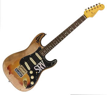 SRV STYLE S-TYPE FENDER PICKUPS: S-Type SRV style guitar, Fender Vintera '50's pickups, worn gold hardware, SRV and "Custom" stickers as well as S.R. Vaughan signature printed on back. 39"H, 13"W, 2"D 7.1lbs **Provenance: an Austin,