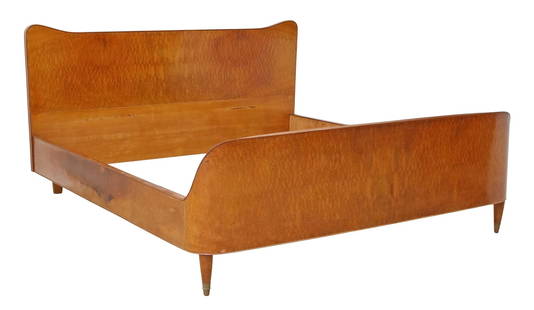 ITALIAN MID-CENTURY MODERN CURVILINEAR WOOD BED: Italian mid-century modern wood bed, c.1950s, having curvilinear shaped frame, rising on tapered legs, ending on brass cap feet, exterior: approx 40"h, 78"l, 72.5"w, interior: approx 75"h, 69.5"w Star