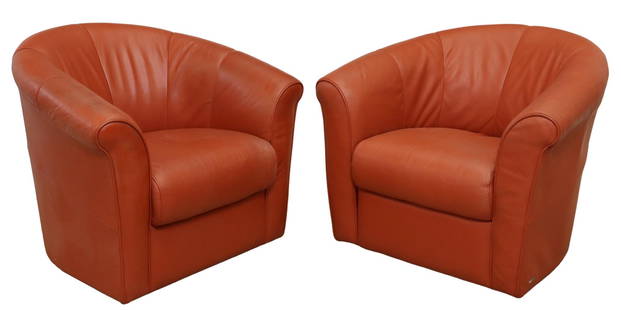 (2) MODERN ITALSOFA RED LEATHER SWIVEL CLUB CHAIRS: (pair) Modern red leather club chairs, Italsofa for Natuzzi, 20th c., having round back, rolled arms with piping trim, rising on swivel base, approx 31.75"h, 36"w, 32"d, seat height: 17.5"h Start Pric