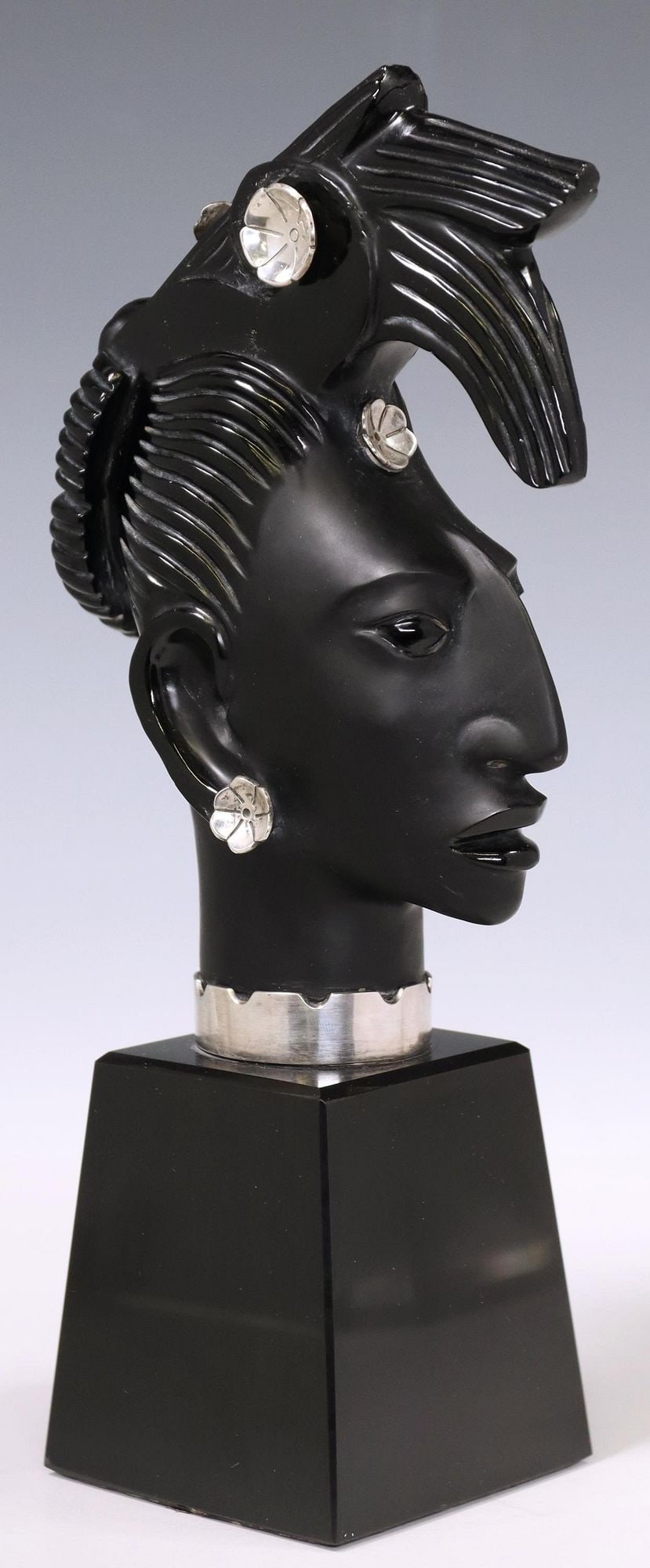 EZEQUIEL TAPIA (ATTR.) OBSIDIAN & SILVER SCULPTURE: Obsidian and silver (content unknown) sculpture, "Cabeza Palenque," unsigned, attributed to Ezequiel Tapia (Mexican, 20th c.), titled and dated 1988 on label underfoot, approx 10 5/8"h, 3"w, 3"d, 4.25