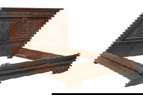 ITALIAN RENAISSANCE REVIVAL CARVED WALNUT BED: Italian Renaissance Revival carved walnut bed, early 20th c., having paneled headboard with central mask motifs, flanked by columnar corner posts and foliate scrollwork, molded rails and baseboard, ri