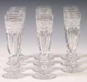 (11) BACCARAT 'JONZAC' CRYSTAL CHAMPAGNE FLUTES: (lot of 11) French crystal champagne flutes, Baccarat, in the "Jonzac" pattern, laurel band, paneled bowl, wafer stem, on a star foot, approx 7"h, 2.75"diam; 7lbs total Start Price: $200.00