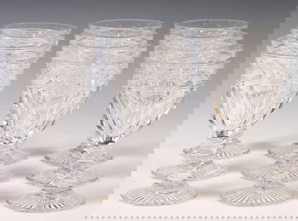 (9) BACCARAT 'JONZAC' CRYSTAL WATER GOBLETS: (lot of 9) French crystal water goblets, Baccarat, in the "Jonzac" pattern, laurel band, paneled bowl, wafer stem, on a star foot, one with minor chip to fluting, approx 6.25"h, 3.25"diam; 9lbs total