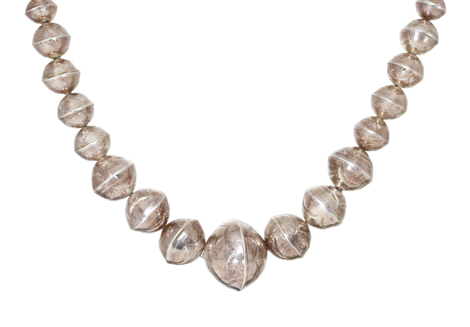 NAVAJO PEARLS STAMPED SILVER BENCH BEADED NECKLACE: Native American silver (content unknown) necklace, likely Navajo/ Dine, fifty-one graduated bench beads, (fifteen) with stamped designs, conical findings, hook closure, approx 24"l, 66 grams **Note: J