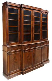 ENGLISH MAHOGANY BREAKFRONT BOOKCASE: English mahogany breakfront bookcase, 19th c., four glazed and mullioned doors, interior shelves, over four drawers, four paneled cabinet doors, on conforming plinth, approx 94.5"h, 88"w, 18"d Start P