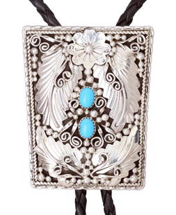 GARY EDWARDS NAVAJO SILVER & TURQUOISE BOLO TIE: Native American sterling silver cuff bolo tie, signed GE (Gary Edwards, Navajo, 20thc.), feather, floral and bead design set with (two) turquoise cabochons, silver bolo tips, with matched dangles, on