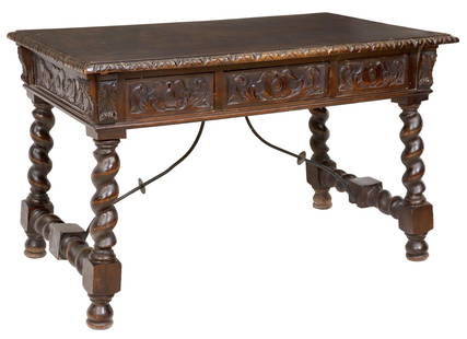 SPANISH BAROQUE STYLE CARVED WOOD WRITING DESK: Spanish Baroque style carved wood writing desk/ table, 19th c., having rectangular top with molded trim, over three drawers, rising on spiral twist supports, joined by iron cross stretcher, approx 32"