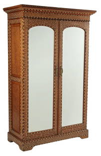 BRITISH COLONIAL STYLE INLAID TWO-DOOR ARMOIRE: British Colonial style inlaid armoire, having dual cabinet doors,fitted interior, rising on bracket feet, approx 74"h, 47"w, 21.5"d Start Price: $1000.00