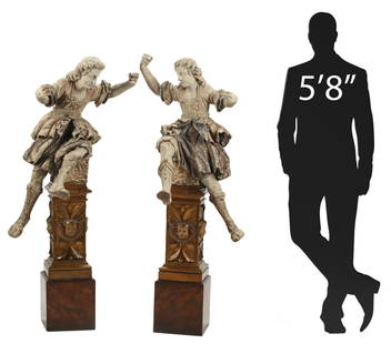 2) BAROQUE STYLE CARVED ARCHANGELS & PLINTHS, 61"H: (pair) Italianate Baroque style carved and polychromed wood figures of archangels on pedestals, each figure in dynamic pose, on base with cherub masks, marbleized plinth, (one) plinth with restoration