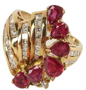 ESTATE 14KT YELLOW GOLD RUBY & DIAMOND RING: Estate 18kt yellow gold ruby and diamond ring, six pear shaped rubies, approx 2.79ccttw, thirty-three chanel set and three round brilliant diamonds, approx 1.50cttw, average color: H-I, average clarit