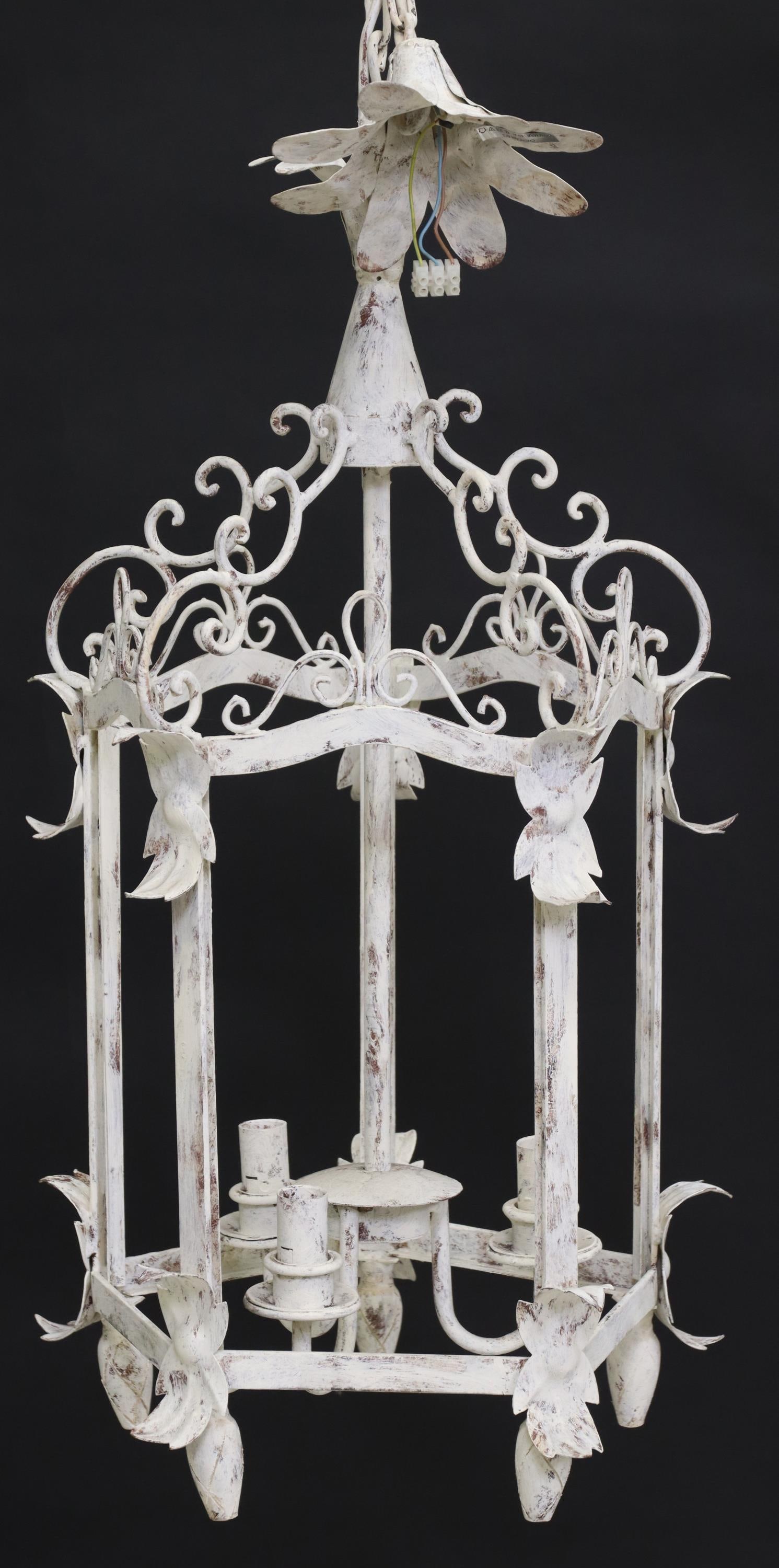WHITE PAINTED WROUGHT IRON 3-LT HANGING LANTERN: Wrought iron three-light hanging lantern, early 20th c., having paneled frame with scrolled crest and foliate motifs, in a distressed white painted finish, three interior lights, in need of wiring, ap