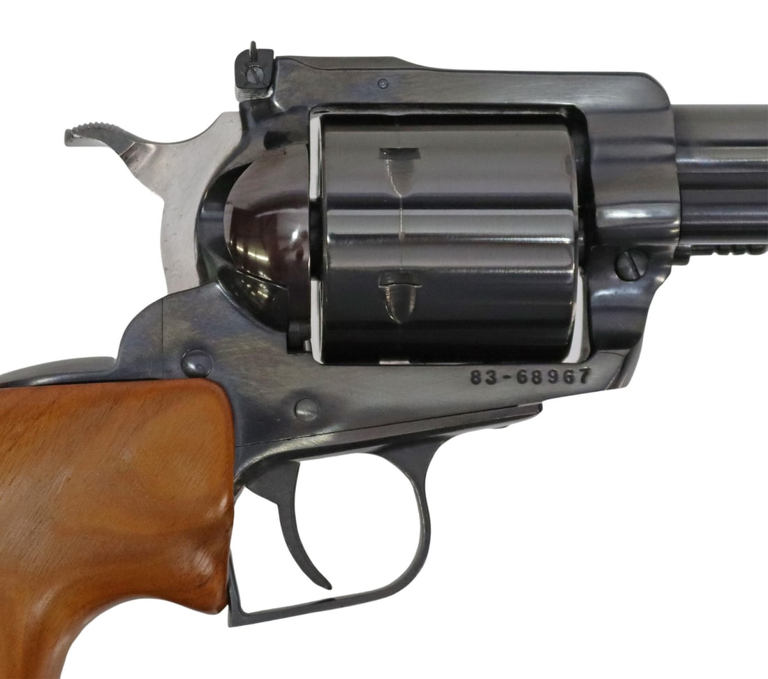 RUGER SUPER BLACKHAWK .44 MAG REVOLVER 10.5" BRL: Ruger Super Blackhawk Revolver, single action, .44 Mag caliber, 10.5" barrel, fixed front sight, adjustable rear sight, six round cylinder, later wood grips and comes with original logo wood grips, a
