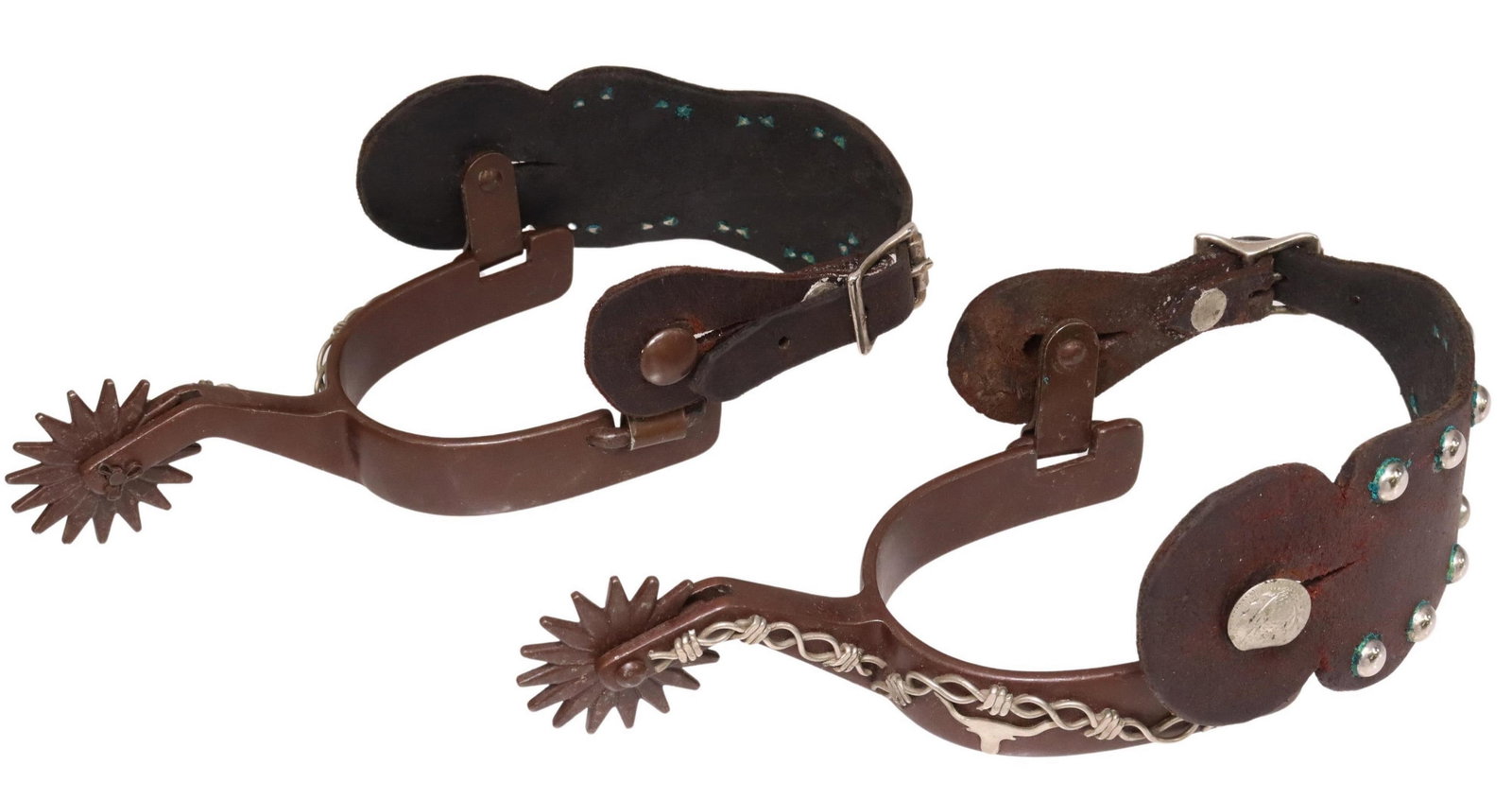 (PAIR) FANCY COWBOY SPURS, LONGHORN & WIRE: (pair) Cowboy Spurs, fancy silver tone decoration including a longhorn cow head, twisted silver tone wire reminiscent of barbed wire, the outer leather button with foliate engraving, 16 point 1.75" ro