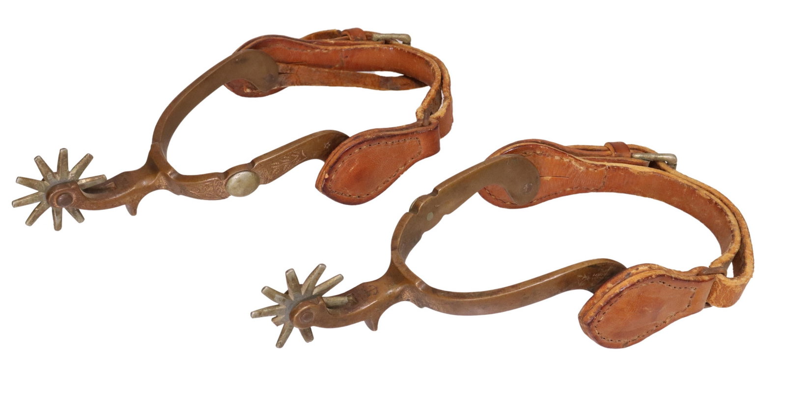 (PAIR) COWBOY SPURS, NORTH & JUDD ANCHOR & STAR: (pair) North & Judd Cowboy spurs, star and anchor marked "Hercules Bronze", each with foliate engraving, 9 point 1.5" rowels, each lacking one point, worn leathers, for shipping 1lb Start Price: $80.0
