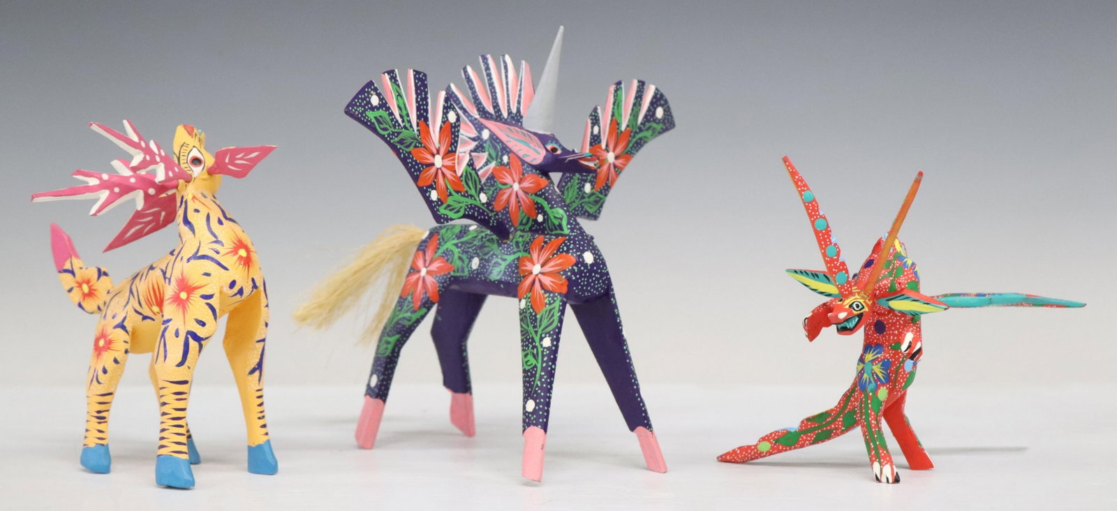 (3) FAMILIA OJEDA & CALVO OAXACA MEXICO ALEBRIJES: (lot of 3) Mexican folk art carved and painted wood alebrije figures, including: (2) signed Rodrigo Melchor (Rodrigo Melchor Ojeda, San Martin Tilcajete, Oaxaca, Mexico, 20th c.), (one) winged unicorn