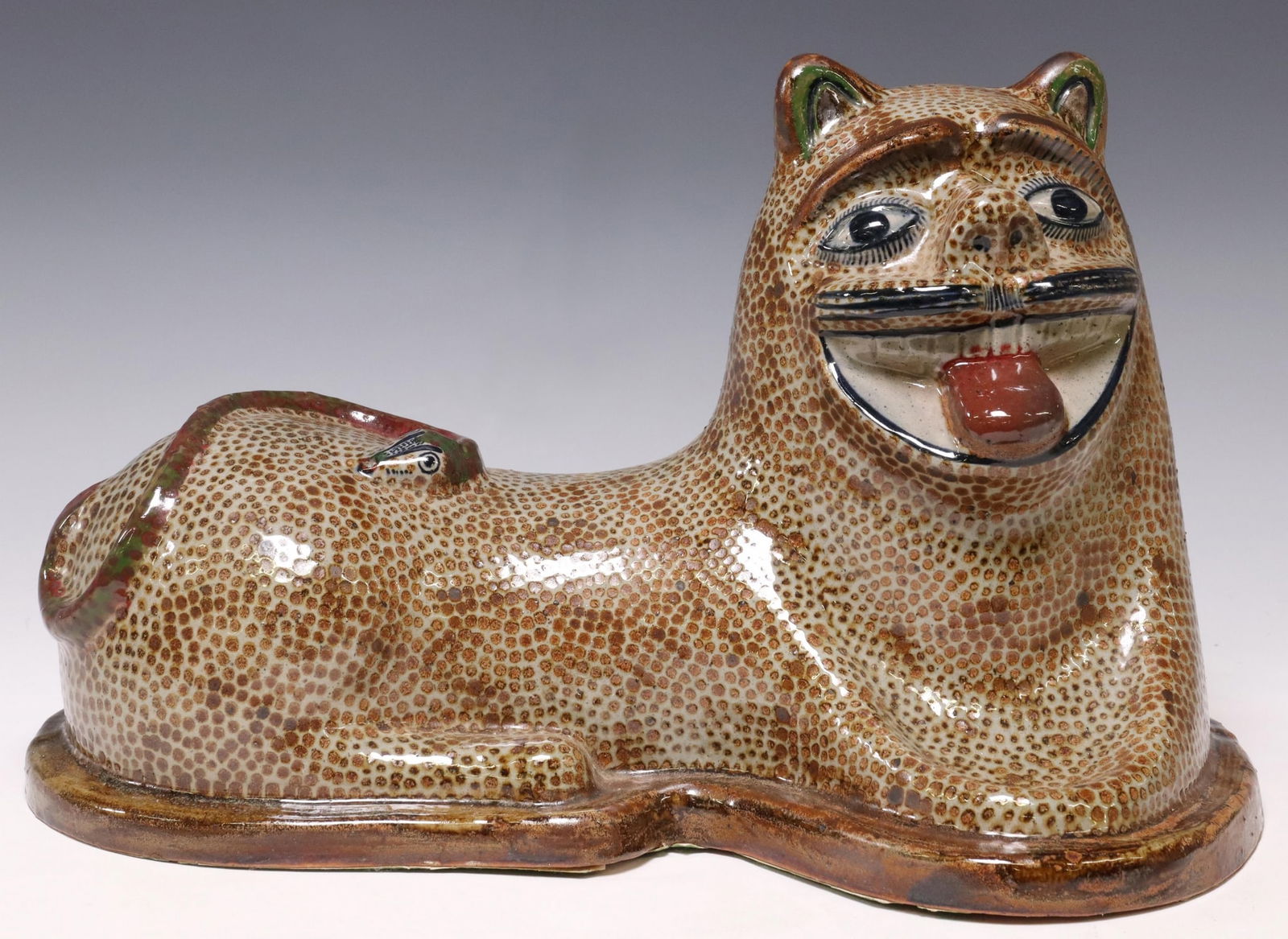 JORGE WILMOT (D.2012) TONALA FOLK ART POTTERY LION: Large Mexican folk art pottery lion, initialed W underfoot (Jorge Wilmot, Tonala, Mexico, 1928-2012), seated cat with open mouth, snake motif on top, approx 10"h, 15.5"w, 9.5"d, 9.2lbs Start Price: $1