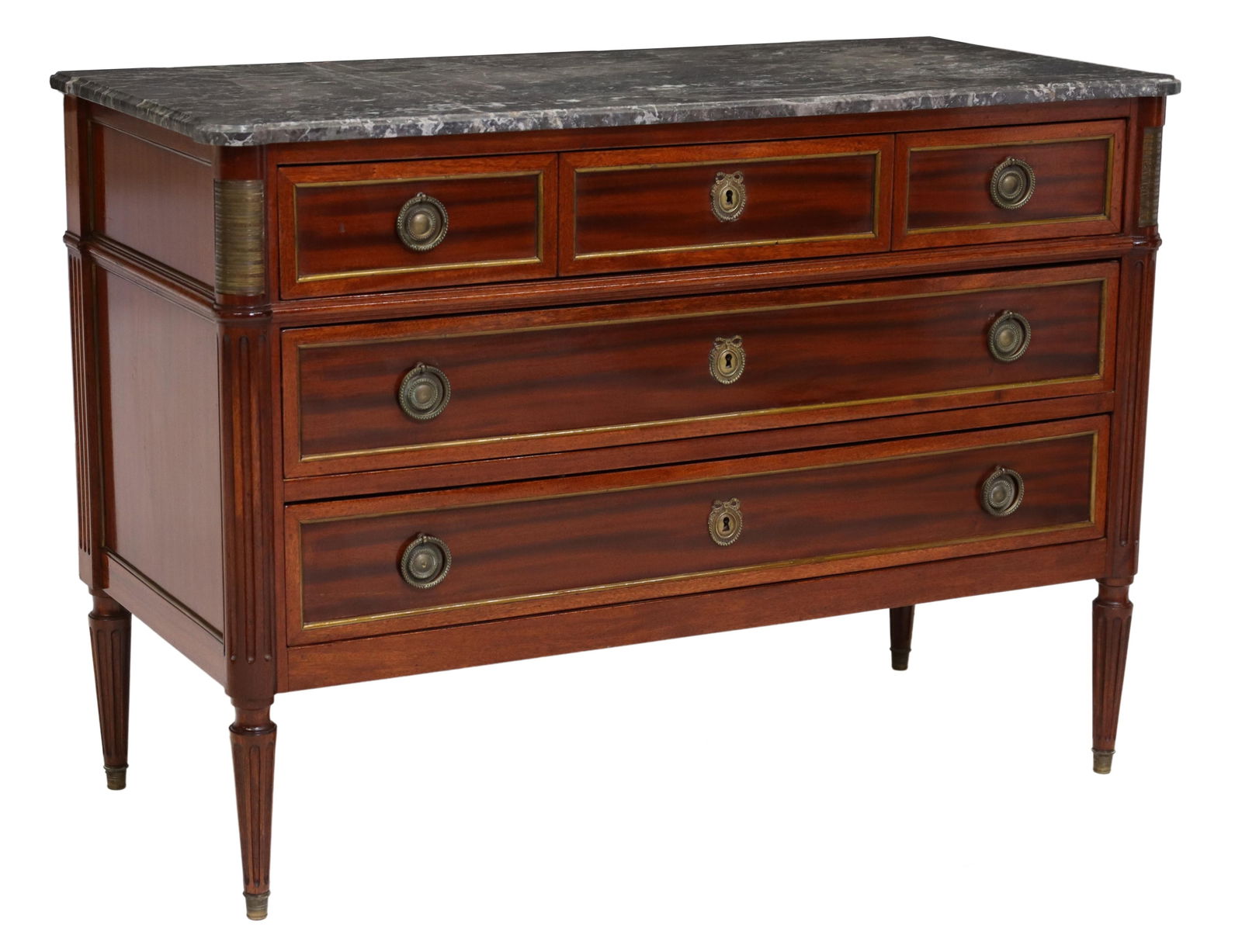 FRENCH LOUIS XVI STYLE MARBLE-TOP MAHOGANY COMMODE: French Louis XVI style mahogany commode, late 19th c., having shaped marble top, over three drawers, flanked by fluted corner posts, rising on fluted tapered legs, ending on brass cap feet, approx 32"