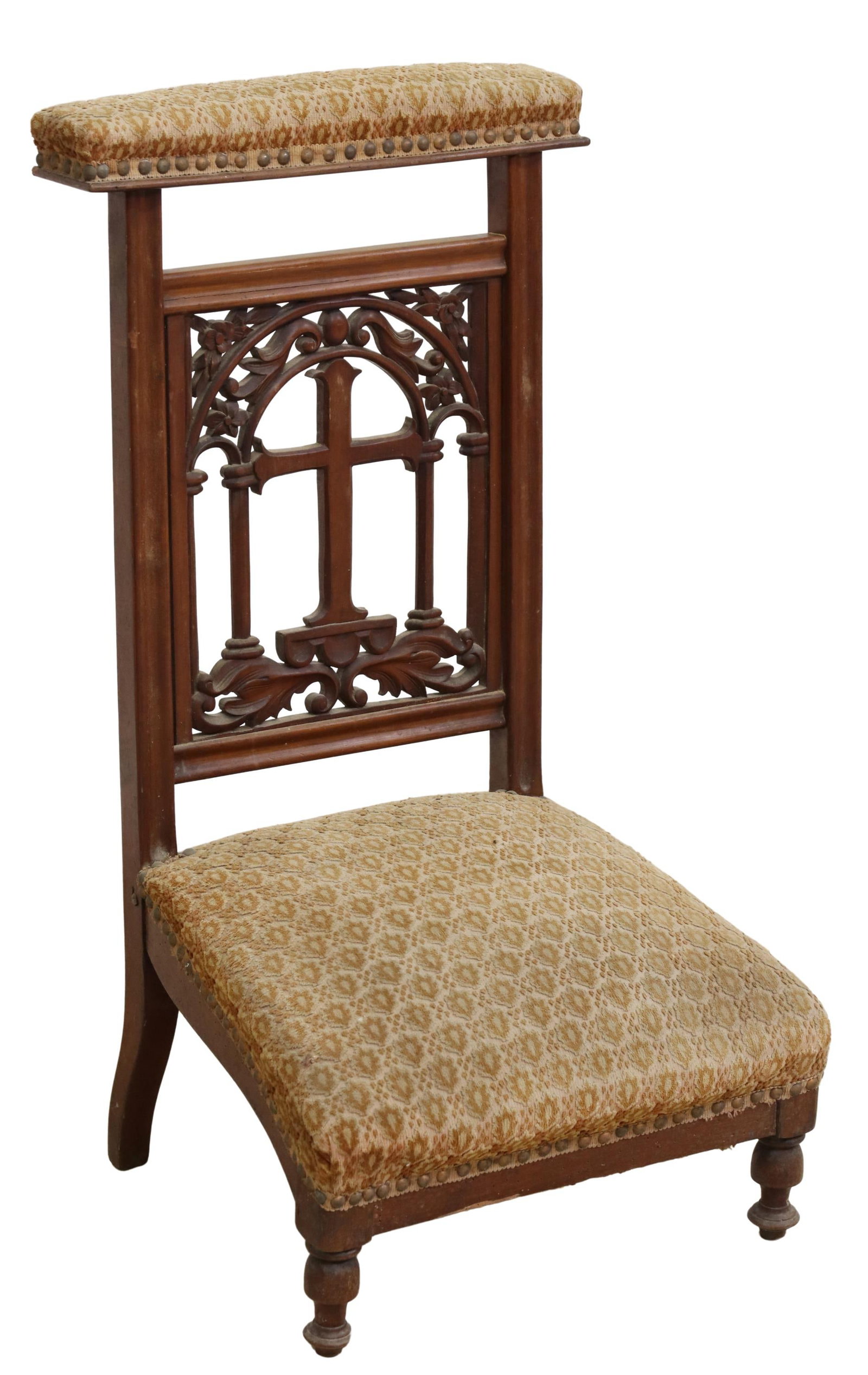 FRENCH CARVED WALNUT & UPHOLSTERED PRIE-DIEU: French carved walnut prie-dieu/ prayer kneeler, late 19th c., padded seat and top rail in patterned fabric upholstery, with nailhead trim, pierced cross back splat, rising on turned feet, approx 33"h,