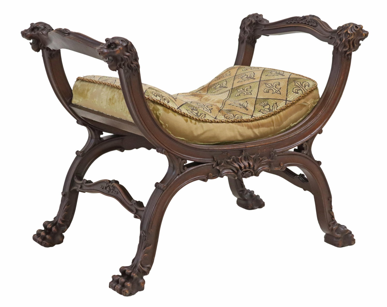 FRENCH RENAISSANCE REVIVAL CARVED CURULE BENCH: French Renaissance Revival curule bench, 20th c., having arm supports with lion masks, over worn fleur-de-lis patterned upholstery seat, ending on paw feet, approx 22.25"h, 28.75"w, 17 5/8"d, seat hei