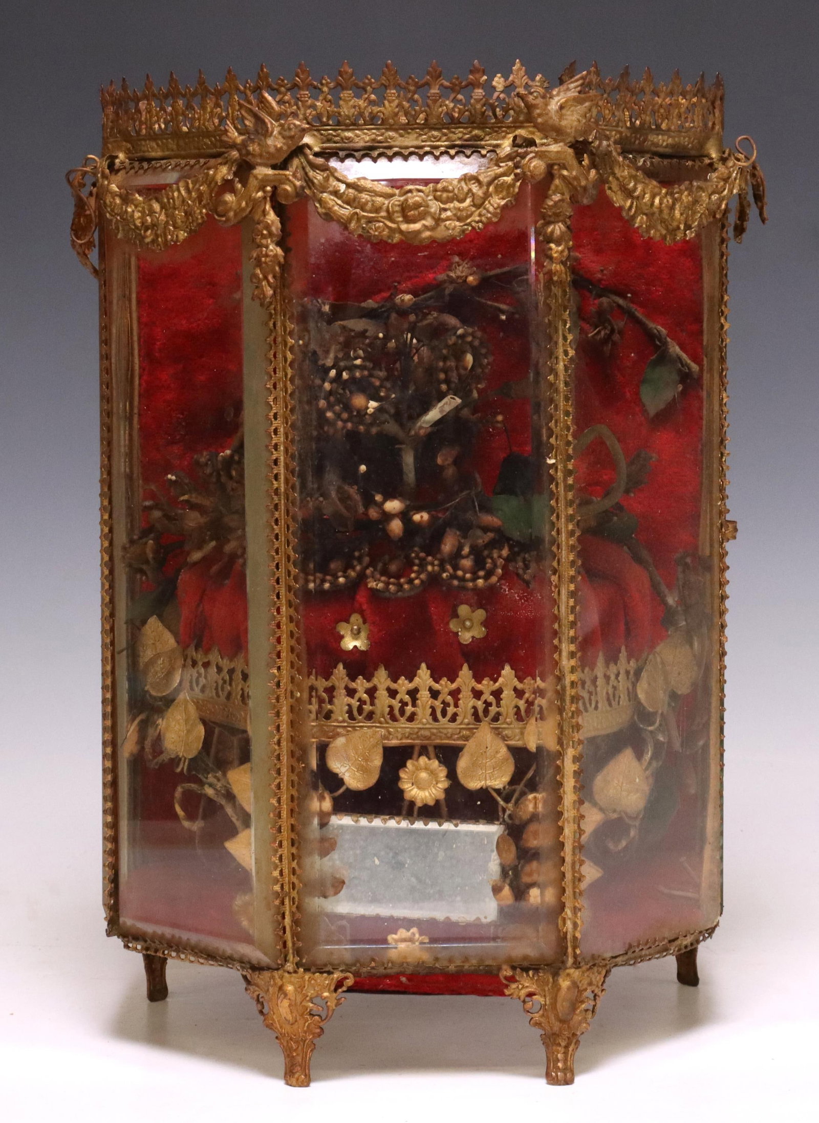 FRENCH GILT METAL PANELED GLOBE DE MARIEE: French paneled globe de mariee/ bride's globe, late 19th c., gilt metal gallery and frame with swags, enclosing five beveled glass panels, tufted cushion with bridal tiara, approx 12.5"h, 9"w, 7"d, 4.