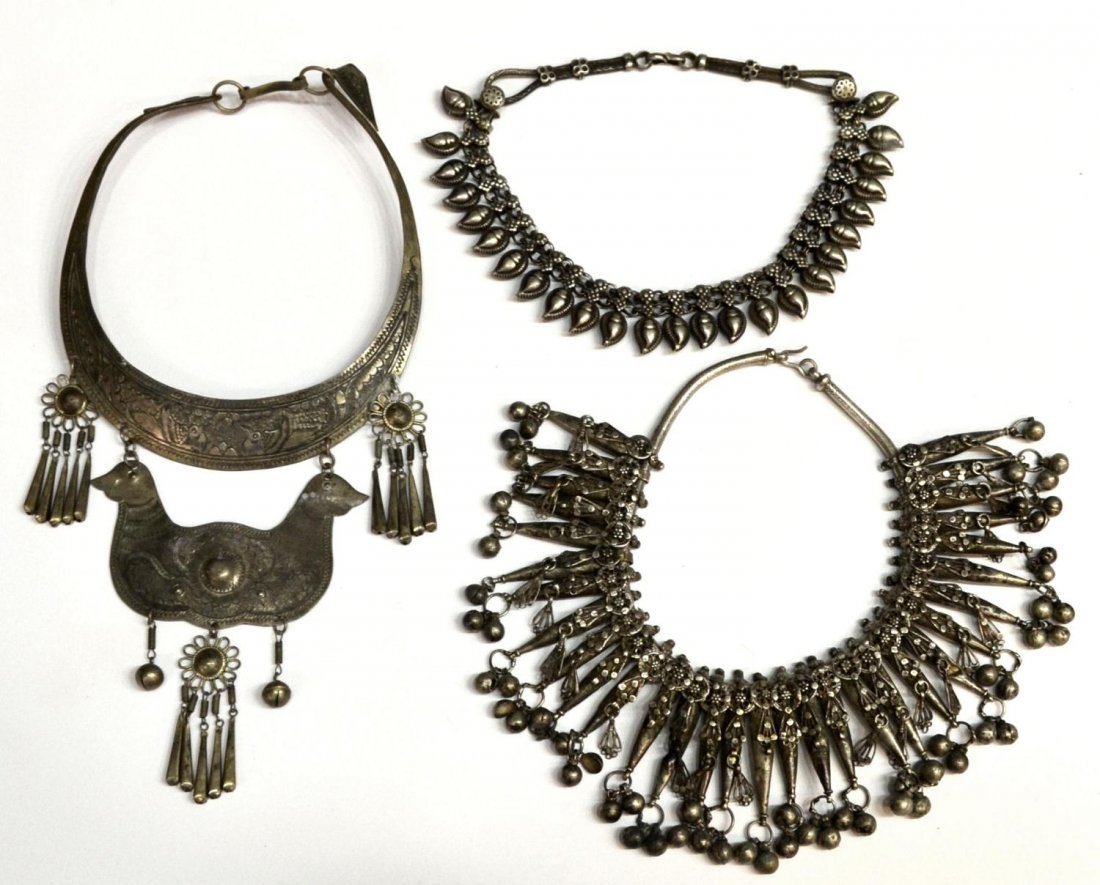 (3) NEPALESE SILVER TONE METAL NECKLACE GROUP: (lot of ) Nepalese silver tone metal necklace group: (1) collar necklace, composed of a curved plaque engraved with birds amidst scrolling foliage, decorative dangles center a pair of birds, unmarked;
