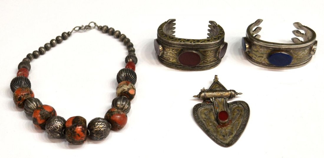 LADIES ENGRAVED LAPIS & CARNELIAN BRACELETS, ETC.: (lot of 4) Jewelry group, possibly from Nepal, comprising: (2) engraved metal bracelets, each with remnants of gilding, one set with blue lapis ovals, the other carnelian ovals, widest: 1.25"h; (1) en