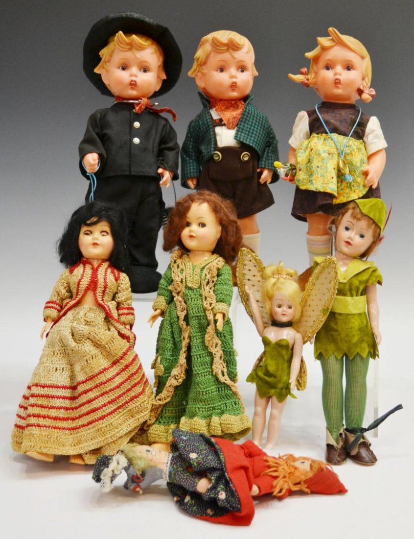 (8)VINTAGE PETER PAN & TINKER BELL & OTHER DOLLS: (lot of 8) Collection of vintage dolls, comprising: (pair) Peter Pan and Tinker Bell with sleep eyes, Peter Pan: 11"h; (3) M.J. Hummel Goebel rubber dolls, each retaining metal tag, 12"h; (1) Red Ridi