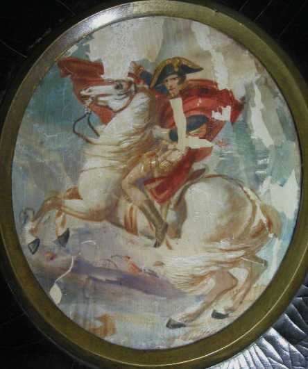 VINTAGE NAPOLEON MINIATURE PICTURE: An antique, probably 19th century, Napoloeon miniature picture based upon the work entitled "Napolen Crossing the Saint-Bernard" by Jaques Louis David (1748-1825). The picture is oval shape about 3"x2