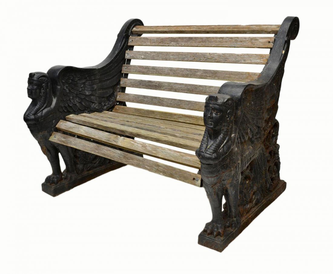 VICTORIAN CAST IRON SPHINX BENCH, C. 1900: British Victorian bench, c. 1900, the cast iron and filled ends formed as sphinx, similar in style generally attributed to SLB Iron Works, Sittingbourne, Kent, England, later wood slats, rusting, appr