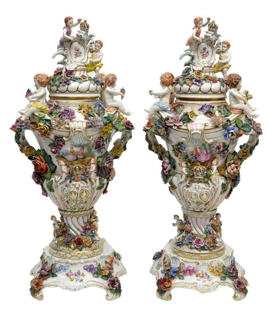 (PAIR) CARL THIEME DRESDEN FIGURAL URNS, 28"H: (pair) Large Carl Thieme handled porcelain baluster vases with covers, early 20th c., a gilded crown surmounting each shaped cover applied with scroll-moulded panels issuing leaves and painted with fl