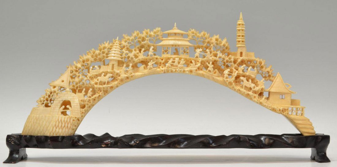 CHINESE PIERCED IVORY TUSK CARVING, LANDSCAPE: **This lot will not be shipped Internationally** Chinese pierced ivory tusk carving, the arched tusk completely and intricately detailed throughout with a village scene of daily life, elaborate pagoda