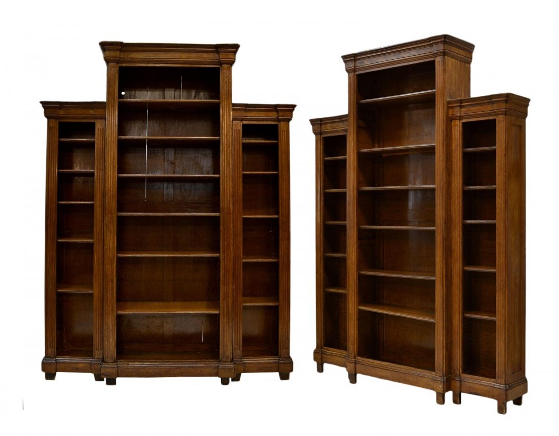 (PAIR) ANTIQUE SPANISH TRIPLE BOOKCASES: (pair) Spanish oak triple bookcase, c. 1900, narrow pilaster faced sections flank a protruding center, each section with adjustable shelves, set on conforming base with block feet, 91.75"h, 68"w, 12"d