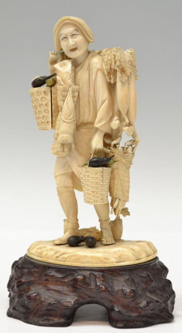JAPANESE IVORY FIGURAL OKIMONO, MEIJI/TAISHO: **This lot will not be shipped Internationally**Japanese ivory figural carving (okimono), Meiji/Taisho period, depicting a farmer walking with a pole suspending a cluster of leafy daikon and straw bun