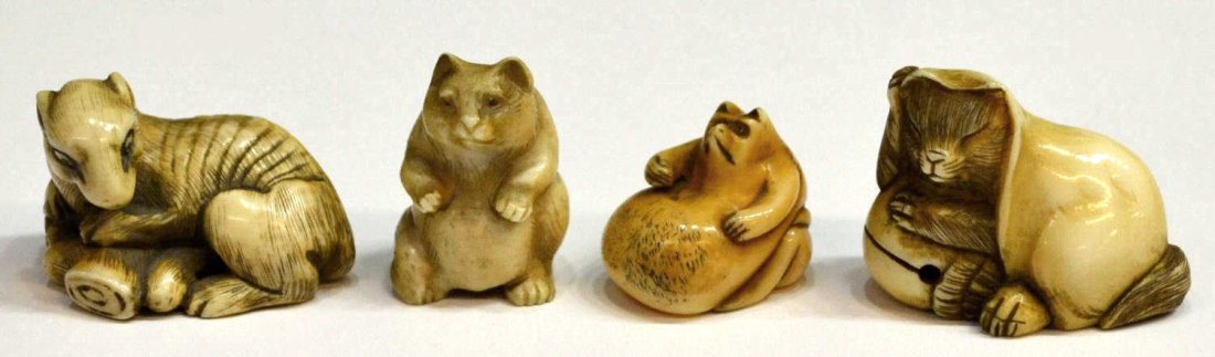 (4) JAPANESE IVORY NETSUKE OF ANIMALS: **This lot will not be shipped Internationally**(lot of 4) Japanese ivory netsuke of animals, each with pigment accents: (1) emaciated wolf or fox, 19th century, hunched over a deer leg, inlaid eyes (