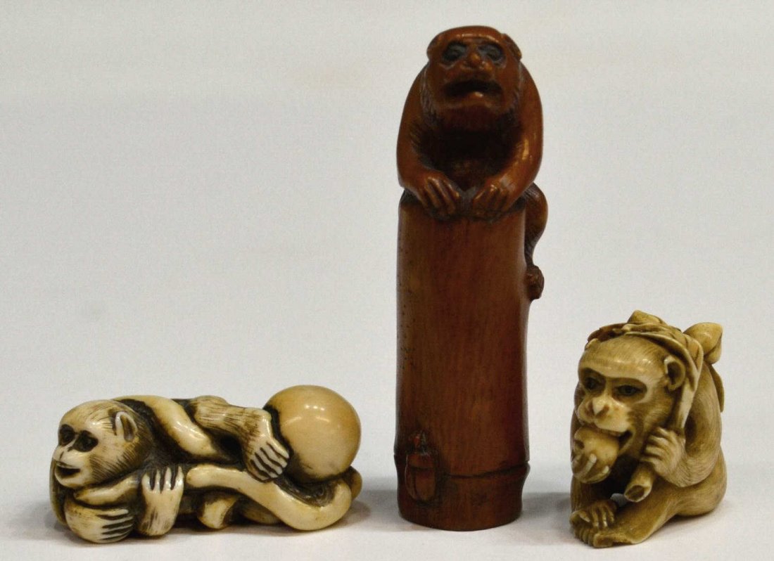 THREE JAPANESE IVORY NETSUKE WITH MONKEYS: **This lot will not be shipped Internationally**(lot of 3) Japanese ivory netsuke: (1) tinted figure of a monkey resting on top of a length of bamboo with an insect near the base, signed [Moto]masa; (