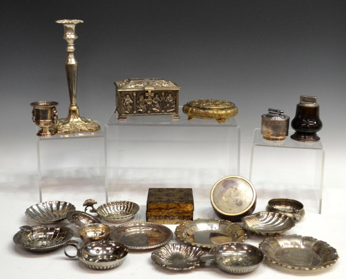 COLLECTION ALPACA , SILVER PLATE & REPOUSSE ITEMS: (lot) Collection of Spanish Alpaca, silver plate and other items including: vintage lighters, numerous ashtrays, some centered by faux coins, shell form pieces, small dishes, plated candlestick, heavy