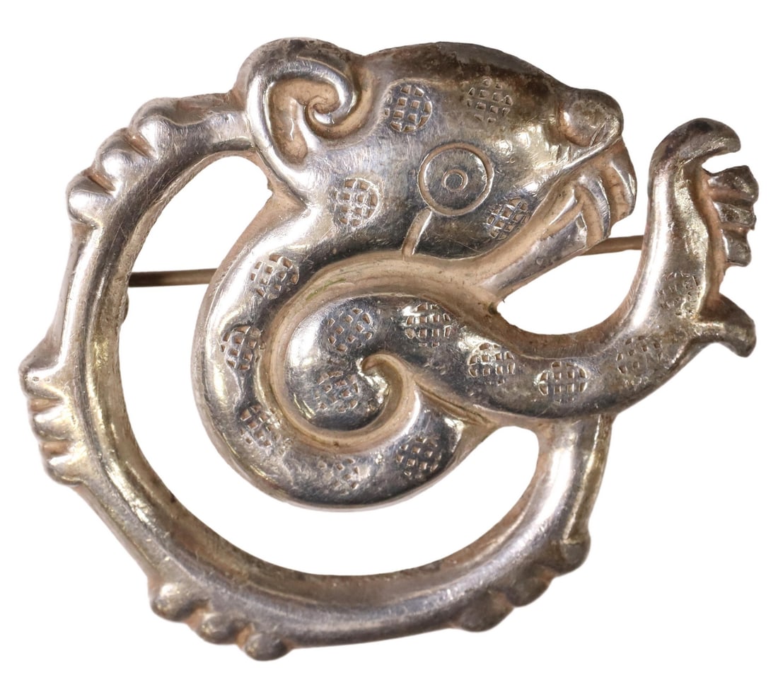 WILLIAM SPRATLING FOR SILSON INC. JAGUAR BROOCH: Silver-tone base metal jaguar-moon brooch, William Spratling (American, active in Taxco, Mexico, 1900-1967) for Victor Silson, c.1940-1944, Pre-Columbian inspired design, Spratling of Mexico Silson In