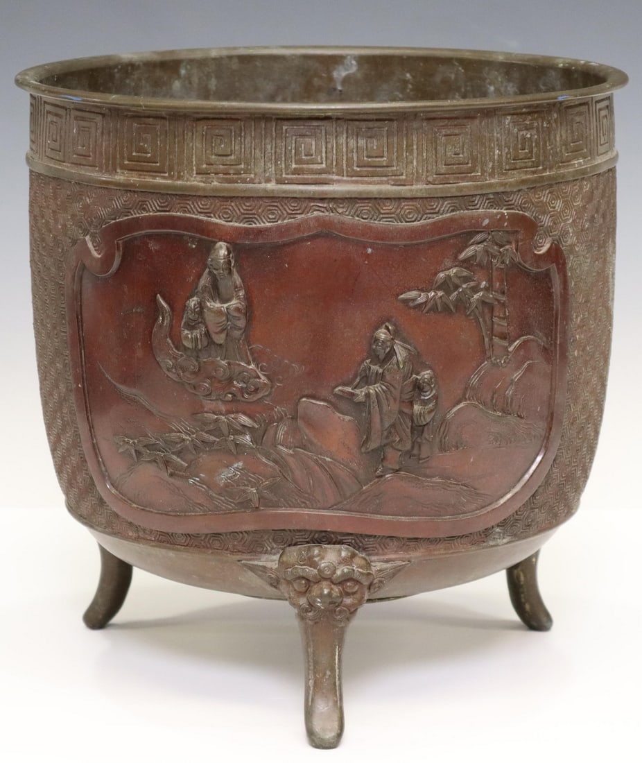 JAPANESE MEIJI PERIOD BRONZE TRIPOD JARDINIERE: Japanese bronze jardiniere/ planter, Meiji period (1868-1912), having meandering rim over fretworked-ground, one side depicting birds in flight, the reverse with deities appearing in auspicious clouds