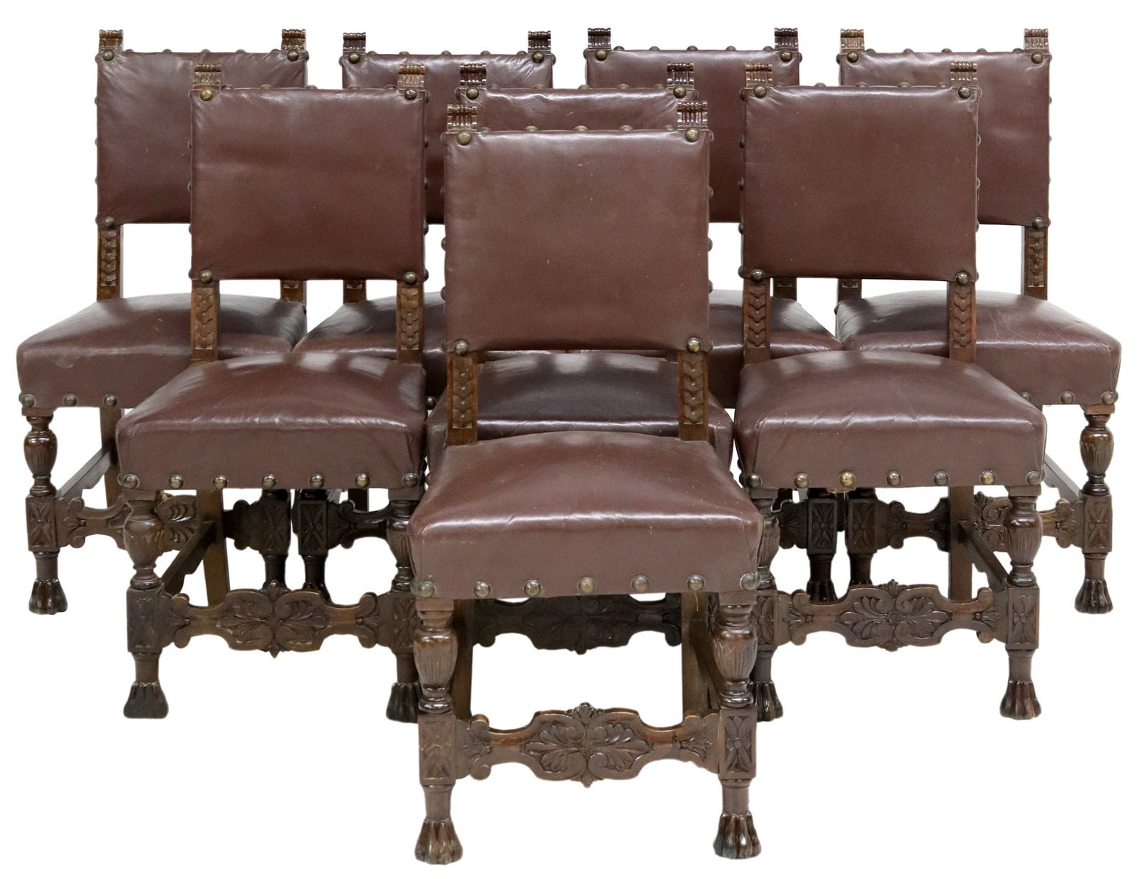 (8) ITALIAN RENAISSANCE REVIVAL LEATHER CHAIRS: (lot of 8) Italian Renaissance Revival leather chairs, early 20th c., heaving carved trefoil pattern trim, rising on turned legs with flower motif, and paw feet, approx 37"h, 18.25"w, 16.75"d, seat he